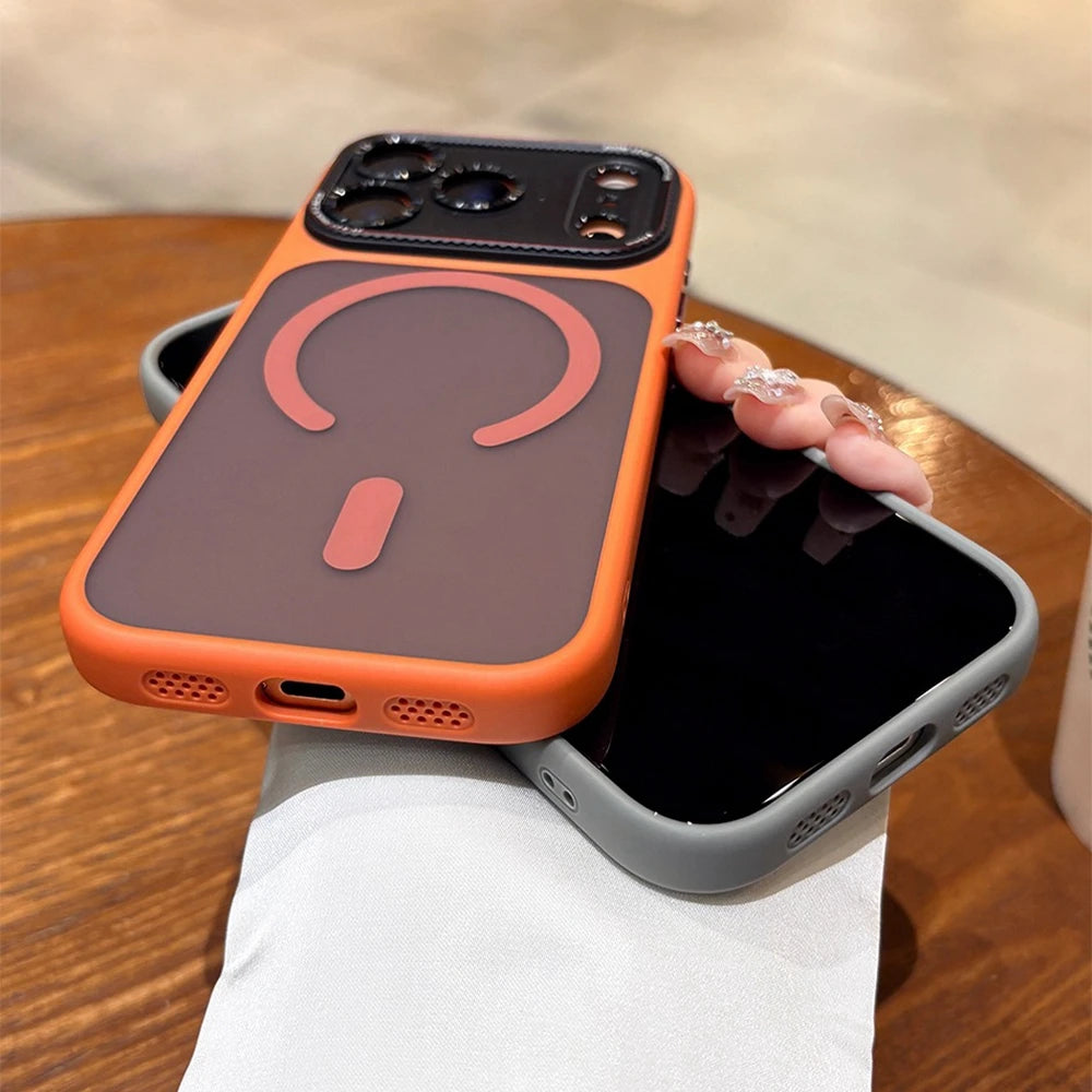 Phone case with wireless charging pad held by a hand on a wooden surface