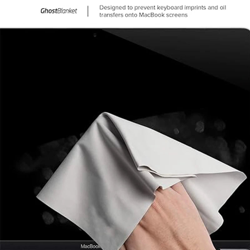 Hand holding a GhostBlanket over a MacBook screen