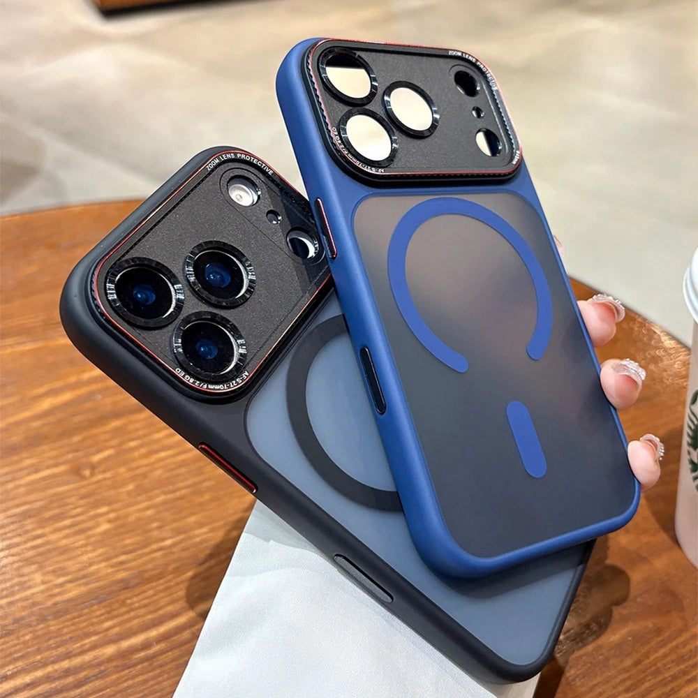 Two phone cases, one black and one blue with a design, on a wooden surface.