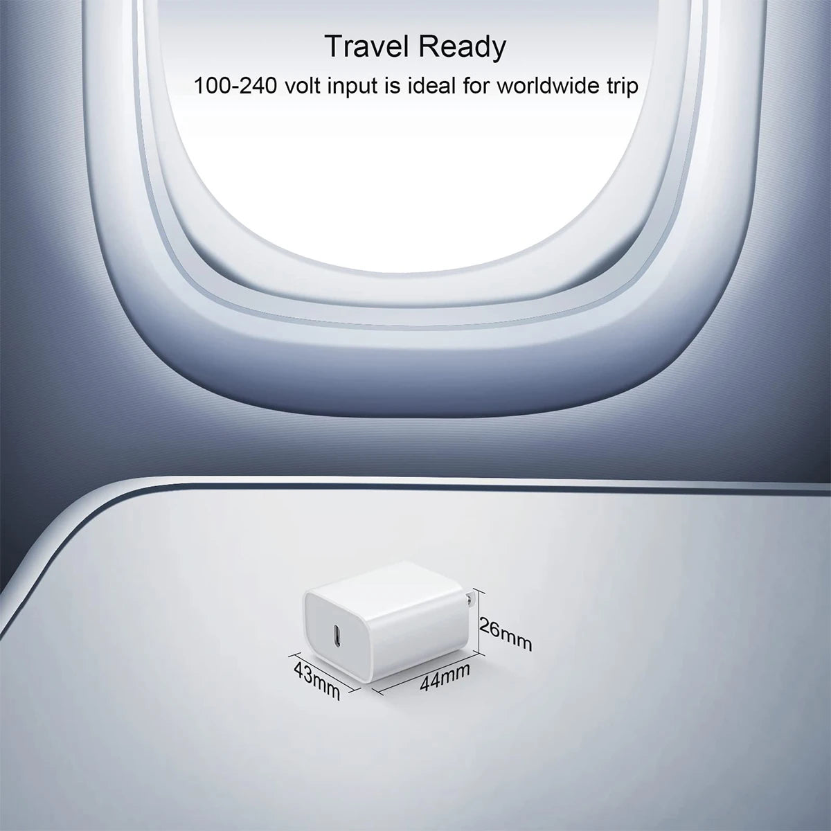 Small white device with dimensions displayed in front of an airplane window, indicating travel readiness.