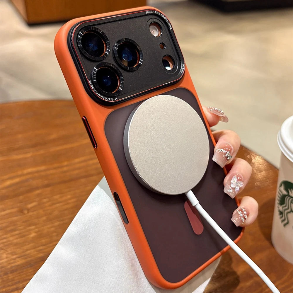 Phone case with magnetic charging pad held by a hand, Starbucks cup in background